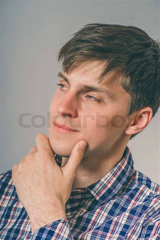 Business man thinking, daydreaming, trying hard to remember something looking confused, isolated yellow background. Negative emotion facial expression. Short-term memory loss, stock photo