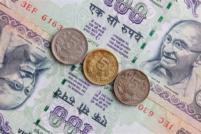 Different banknotes and coins of Indian money, stock photo