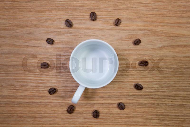 Coffee Time - Empty coffee cup and clock of coffee beans, stock photo