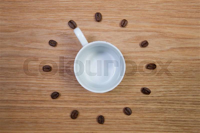 Coffee Time - Empty coffee cup and clock of coffee beans, stock photo