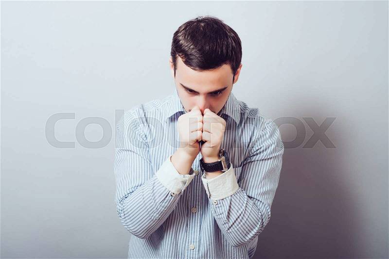 A man prays, stock photo