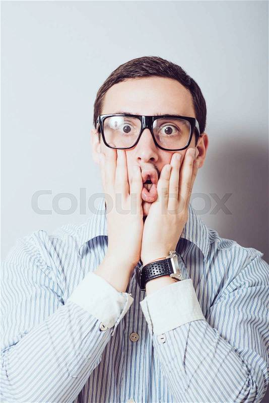 Guy with glasses in shock, stock photo