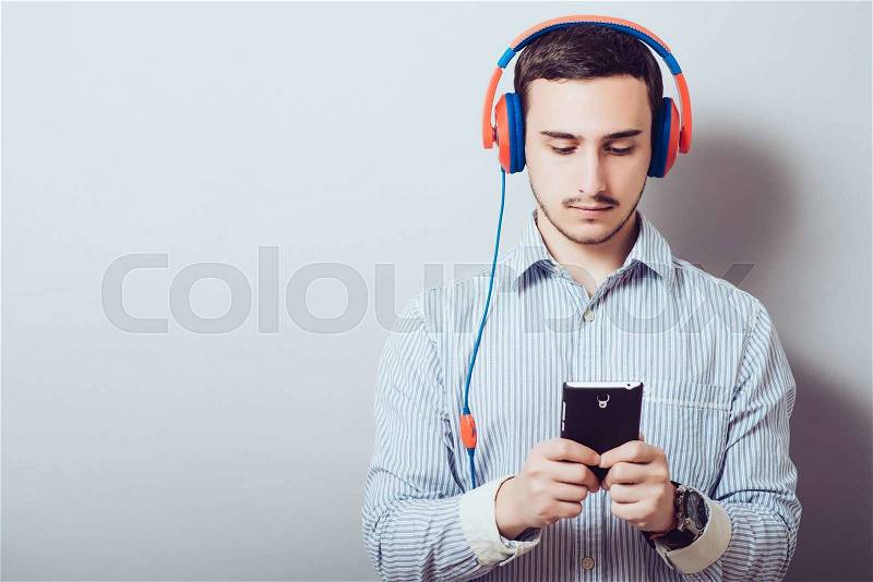 Man listens music with headphones, stock photo