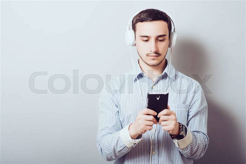 Man listens music with headphones, stock photo