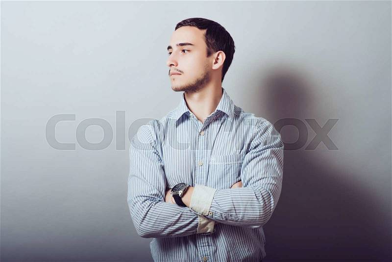 Businessman with his arms folded, stock photo