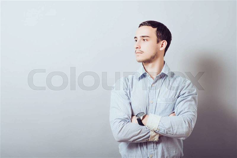 Businessman with his arms folded, stock photo