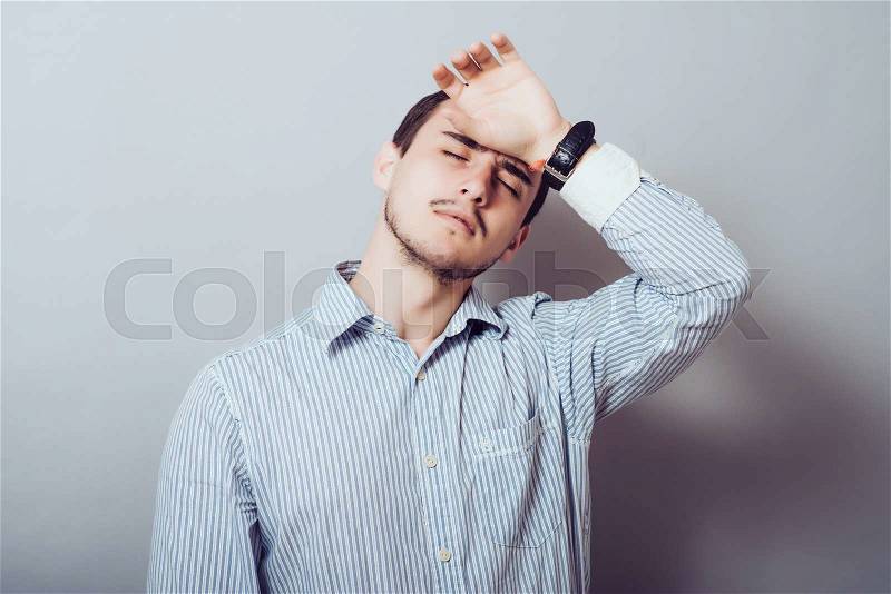 Man was very tired at the office work, stock photo