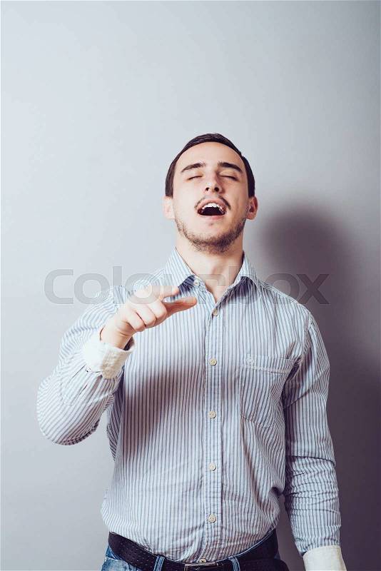 Smart young man pointing at you, stock photo
