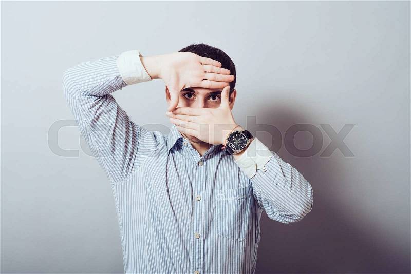 Man making frame hand, stock photo