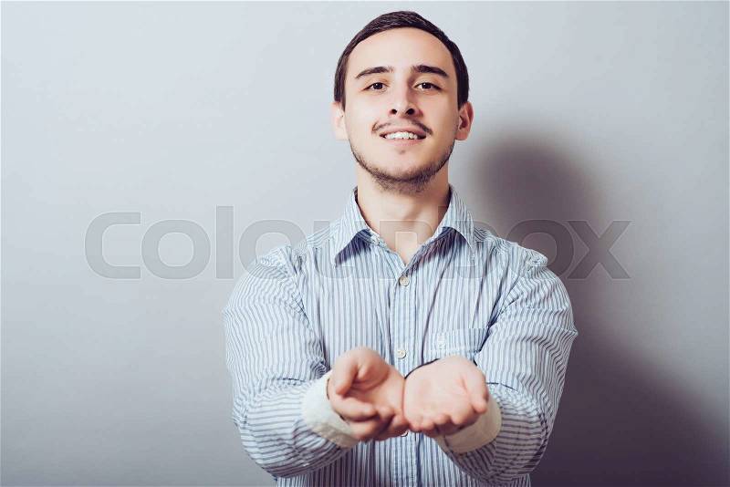Portrait of a young man asking for money, stock photo