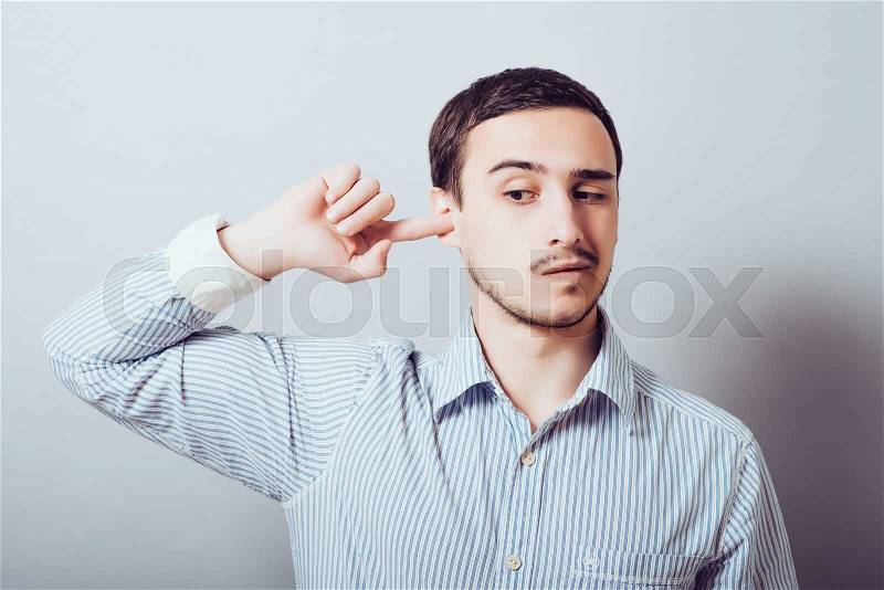 Man Scratching an Itch in His Ear, stock photo