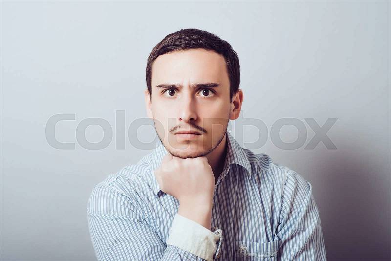 Portrait of a man with his chin hands, stock photo