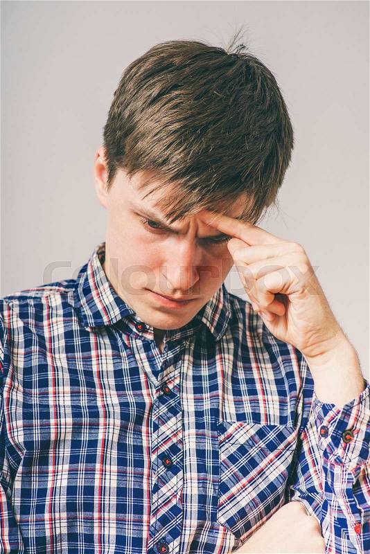 Attractive man thinking of something important, stock photo