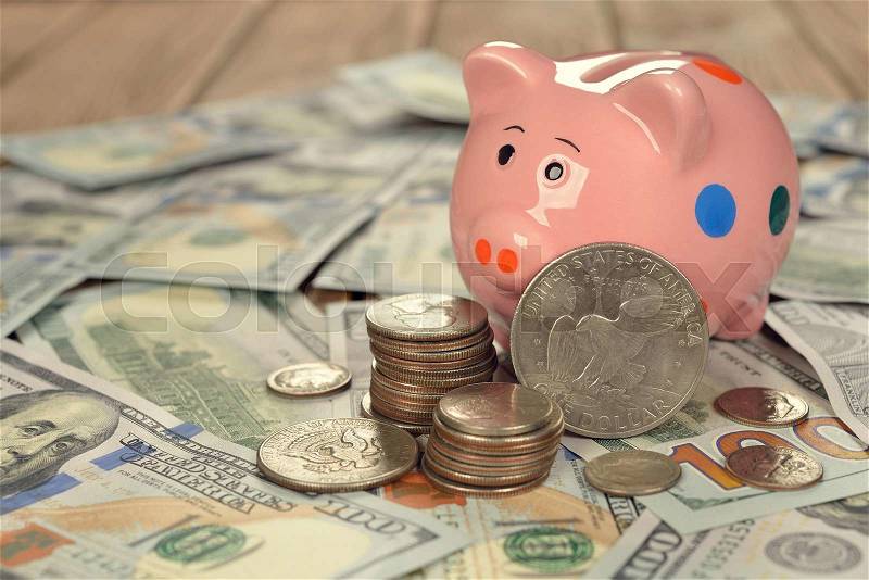 Pig piggy bank with coins, stock photo