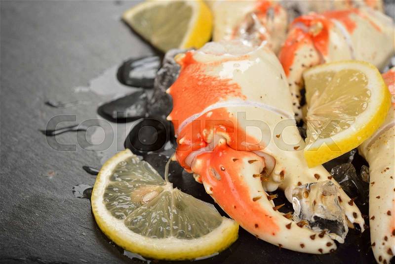 Kamchatka crab claws on a black background, close-up, stock photo