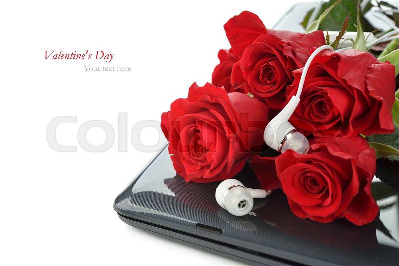 Computer and roses on a white background, Valentine\'s Day concept, stock photo