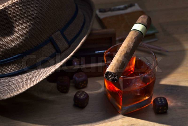 whiskey and cigar on a wooden table, stock photo