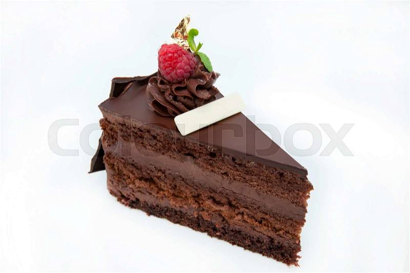 Piece of chocolate cream cake on a white background in the restaurant, stock photo