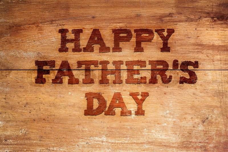 Happy fathers day sign on wooden boards background, stock photo