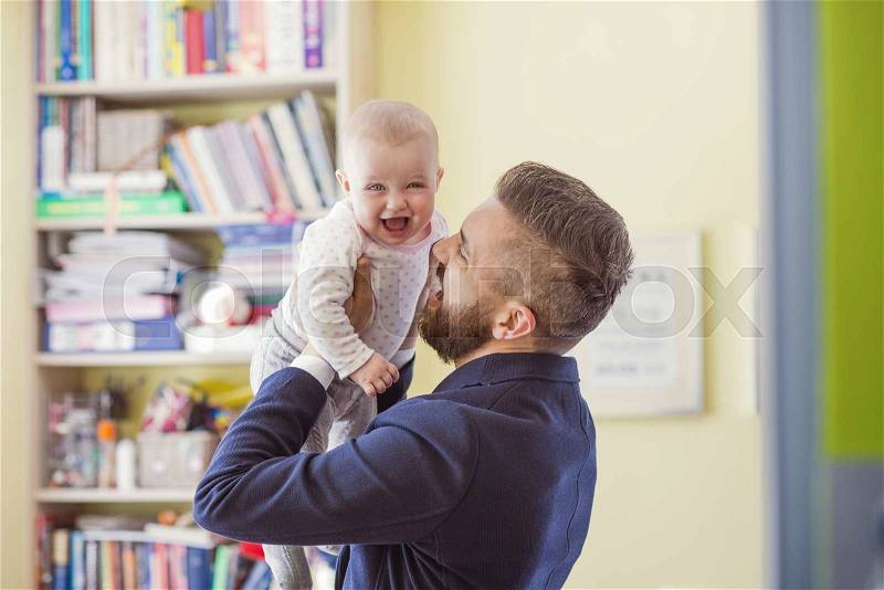 Young father with his cute little baby daughter, stock photo