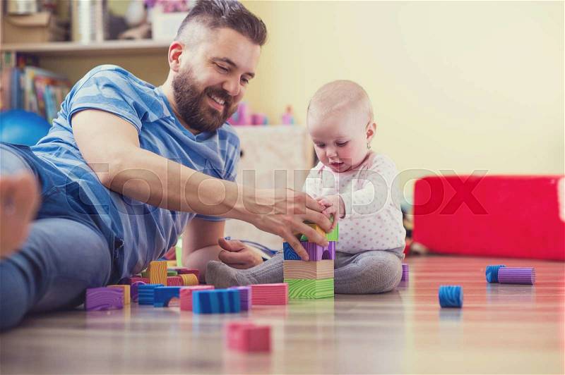 Young hipster father playing with his daughter, stock photo