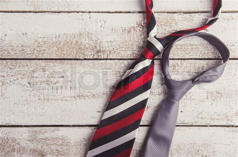 Fathers day composition of two ties laid on wooden floor background, stock photo
