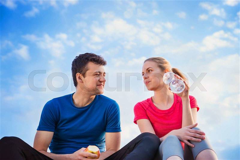 Young runners in nature taking a break, stock photo