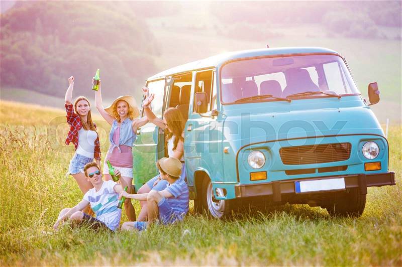 Young hipster friends on road trip on a summers day, stock photo