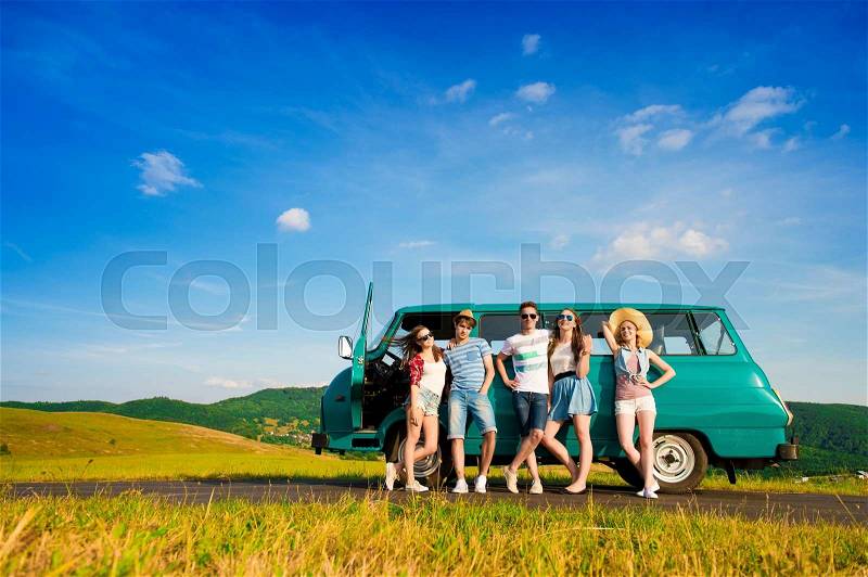 Young hipster friends on road trip on a summers day, stock photo