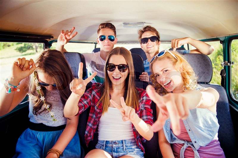Young hipster friends on a road trip on a summers day, stock photo