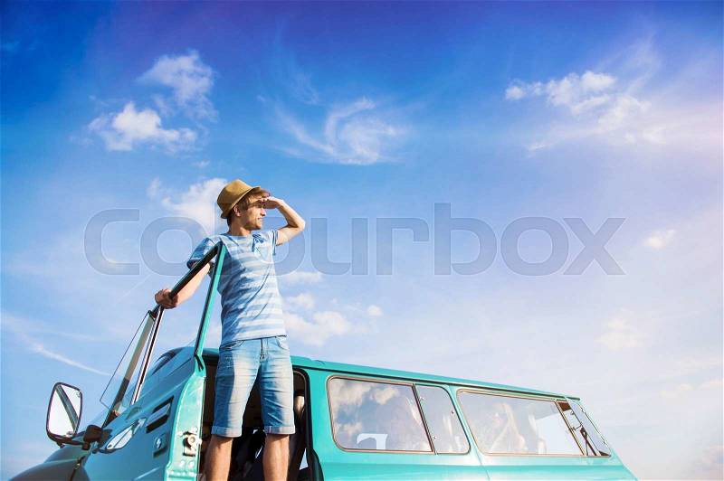 Teenage friends on a road trip on a summers day, stock photo