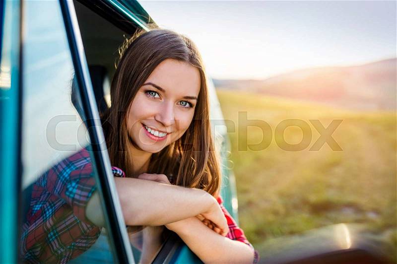 Teenage girl and her friends on a road trip on a summers day, stock photo