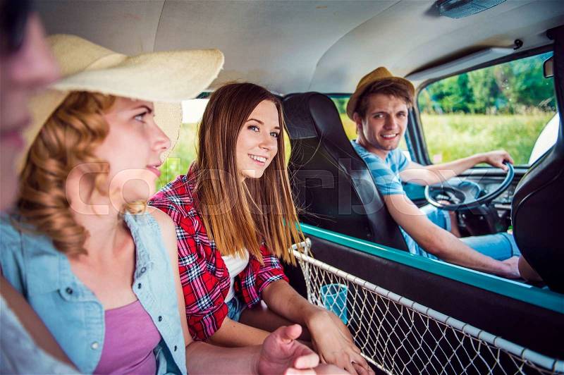 Young hipster friends on a road trip on a summers day, stock photo