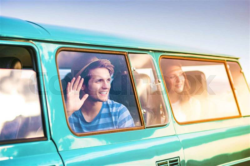 Young hipster friends on road trip on a summer day, stock photo