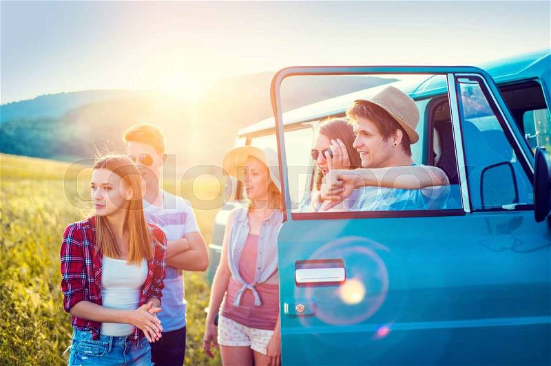 Young hipster friends on road trip on a summer day, stock photo
