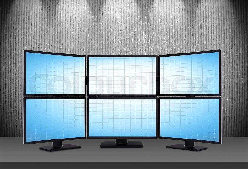 Six blank blue screens on table in room, stock photo