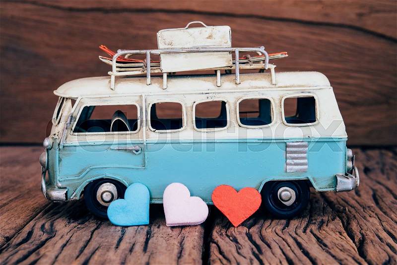 Hearts with blue van background on old wooden table, stock photo
