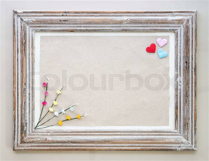 Vintage wooden frame with hearts and flower for Valentine\'s day background, stock photo