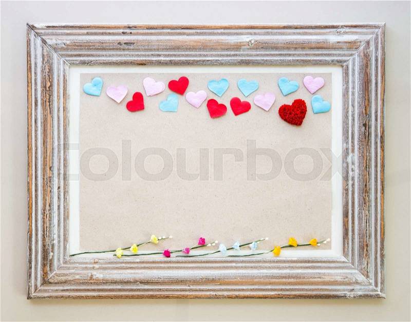 Vintage wooden frame with hearts and flower for Valentine\'s day background, stock photo