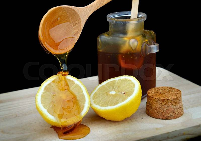 Homemade sticky honey and lemon mixed for healthy, stock photo