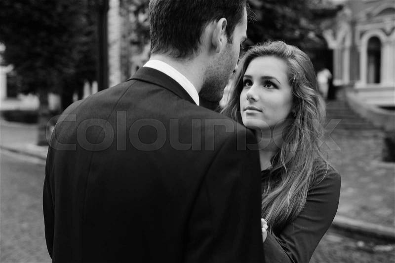 Man and woman arguing on a city street, stock photo