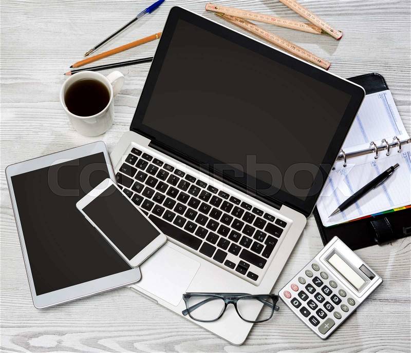 View of a Wood businessman\'s desk in high definition with laptop, tablet and mobile , stock photo
