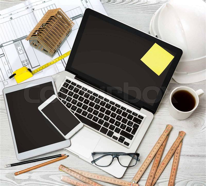 View of a Wood architect\'s desk in high definition with laptop, tablet and mobile , stock photo