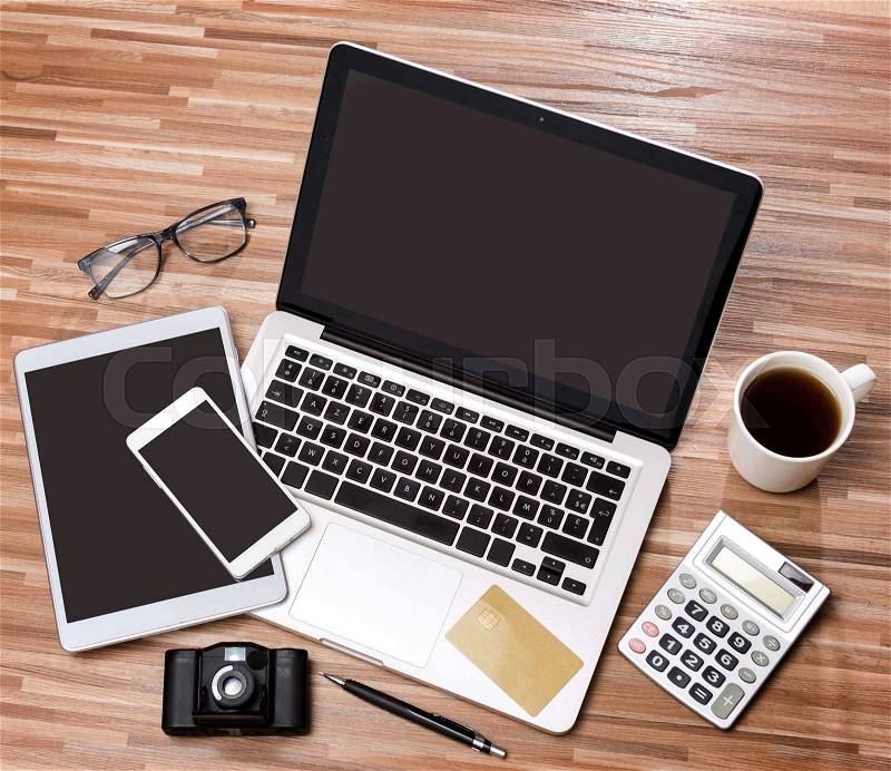 VIew of a Wood businessman\'s desk in high definition with laptop, tablet and mobile , stock photo