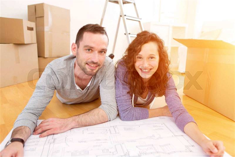 View of a Young couple in love moved in their new flat, stock photo