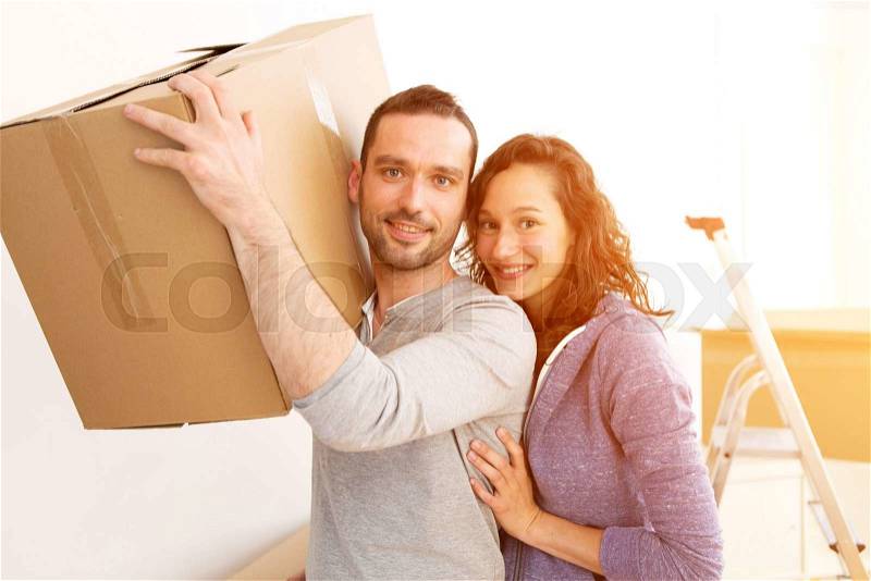 View of a Young couple in love moved in their new flat, stock photo