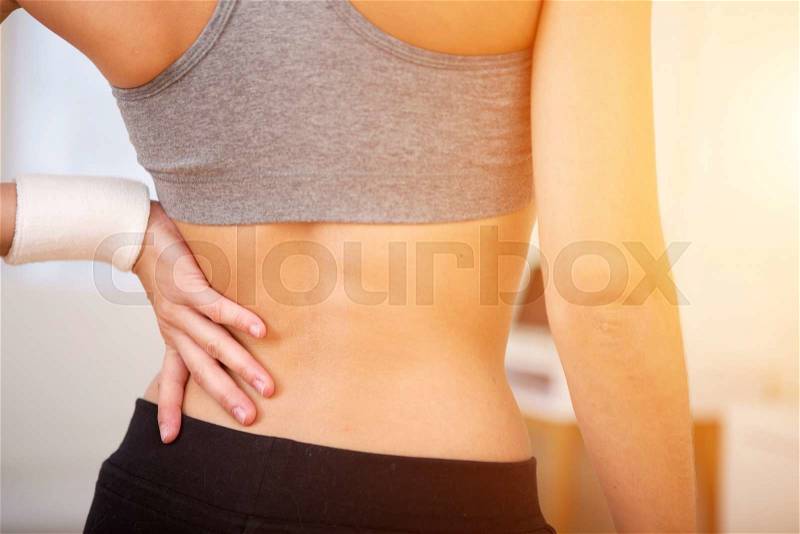 Close up view on the back of a woman doing sport, stock photo