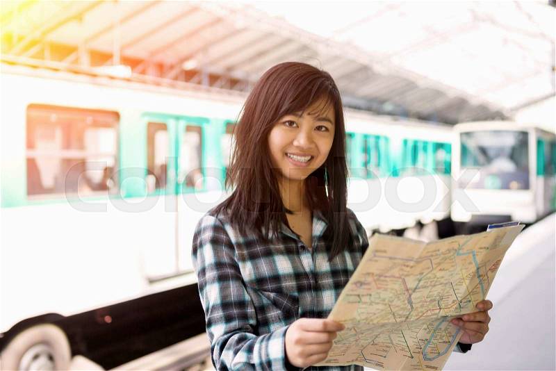 View of a Young attractive asian tourist visiting Paris, stock photo