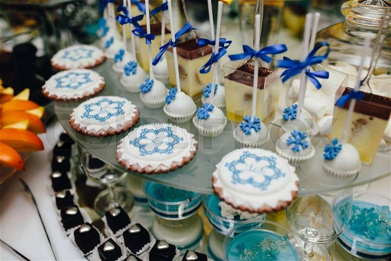 Candy bar on wedding ceremony with a lot of different candies and beverages, stock photo