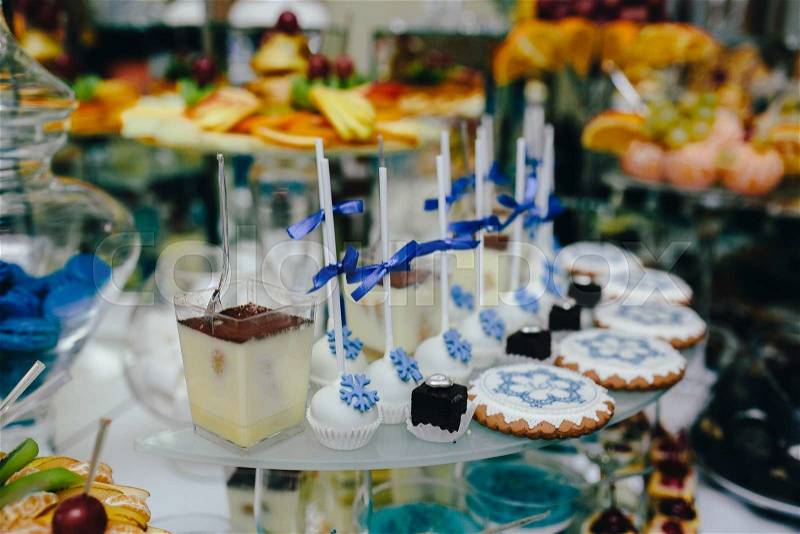 Candy bar on wedding ceremony with a lot of different candies and beverages, stock photo